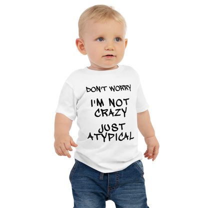 "Don't Worry I'm Not Crazy Just Atypical" printed on a white baby jersey short sleeve tee worn by a male