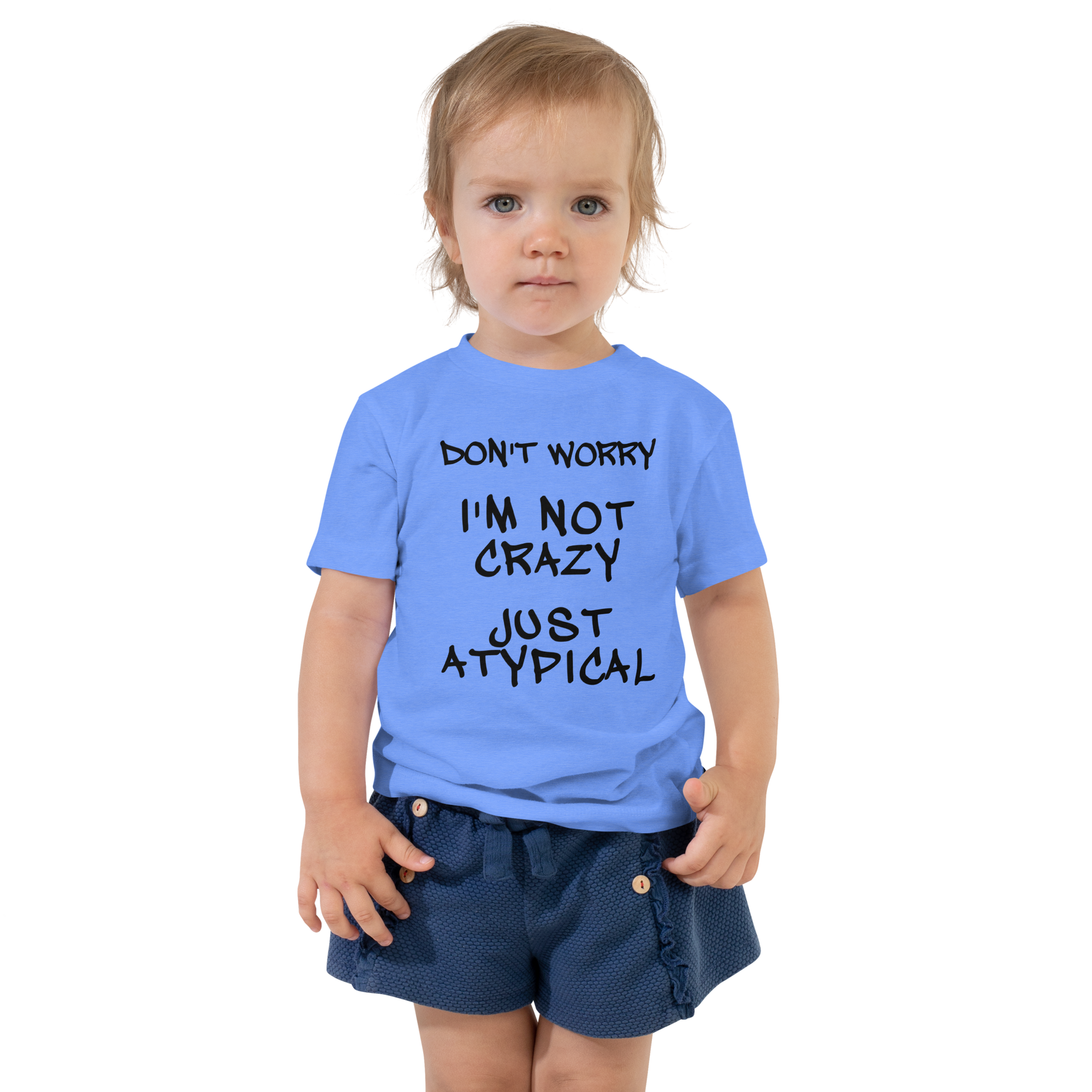 "Don't Worry I'm Not Crazy Just Atypical" printed on a heather columbia blue toddler short sleeve tee worn by a female
