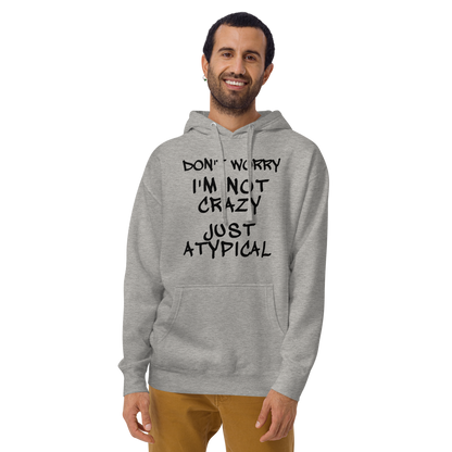 "Don't Worry I'm Not Crazy Just Atypical" printed on a carbon grey warn by a male