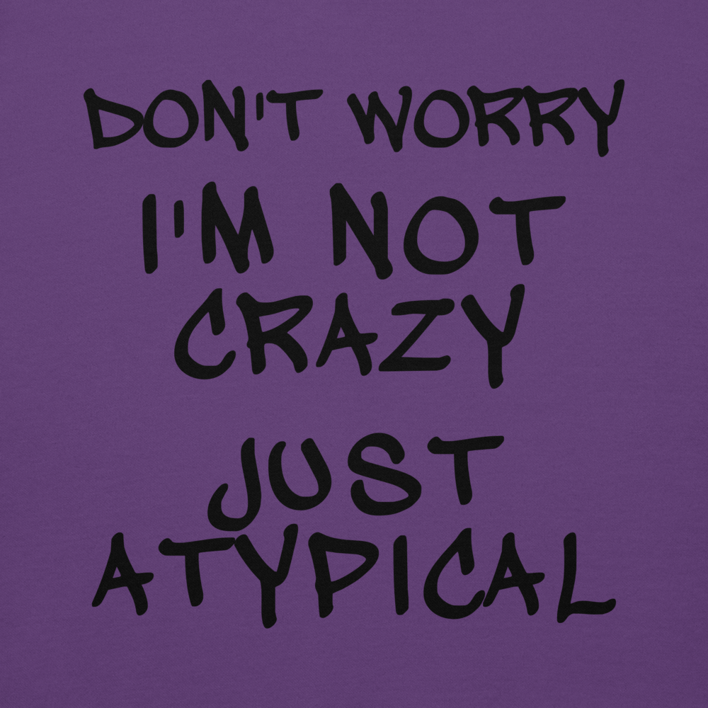 "Don't Worry I'm Not Crazy Just Atypical" printed on a purple background