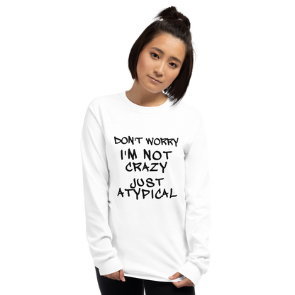 "Don't Worry I'm Not Crazy Just Atypical" printed on a white men's long sleeve shirt worn by a female