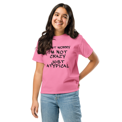 "Don't Worry I'm Not Crazy Just Atypical" printed on a azalea youth classic tee worn by a female