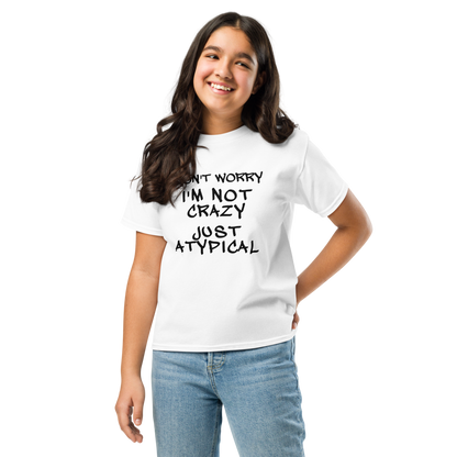 "Don't Worry I'm Not Crazy Just Atypical" printed on a white youth classic tee worn by a female