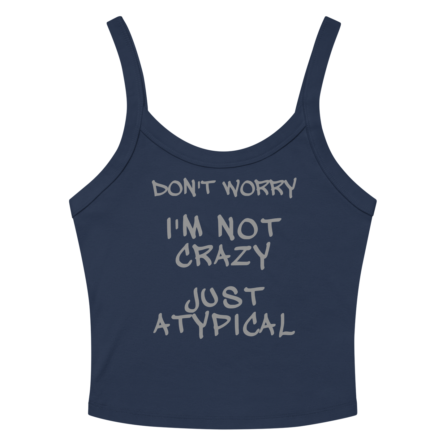 "Don't Worry I'm Not Crazy Just Atypical" printed on a solid navy blend women's micro-rib tanktop laying on a flat surface amongst sunglasses and shorts
