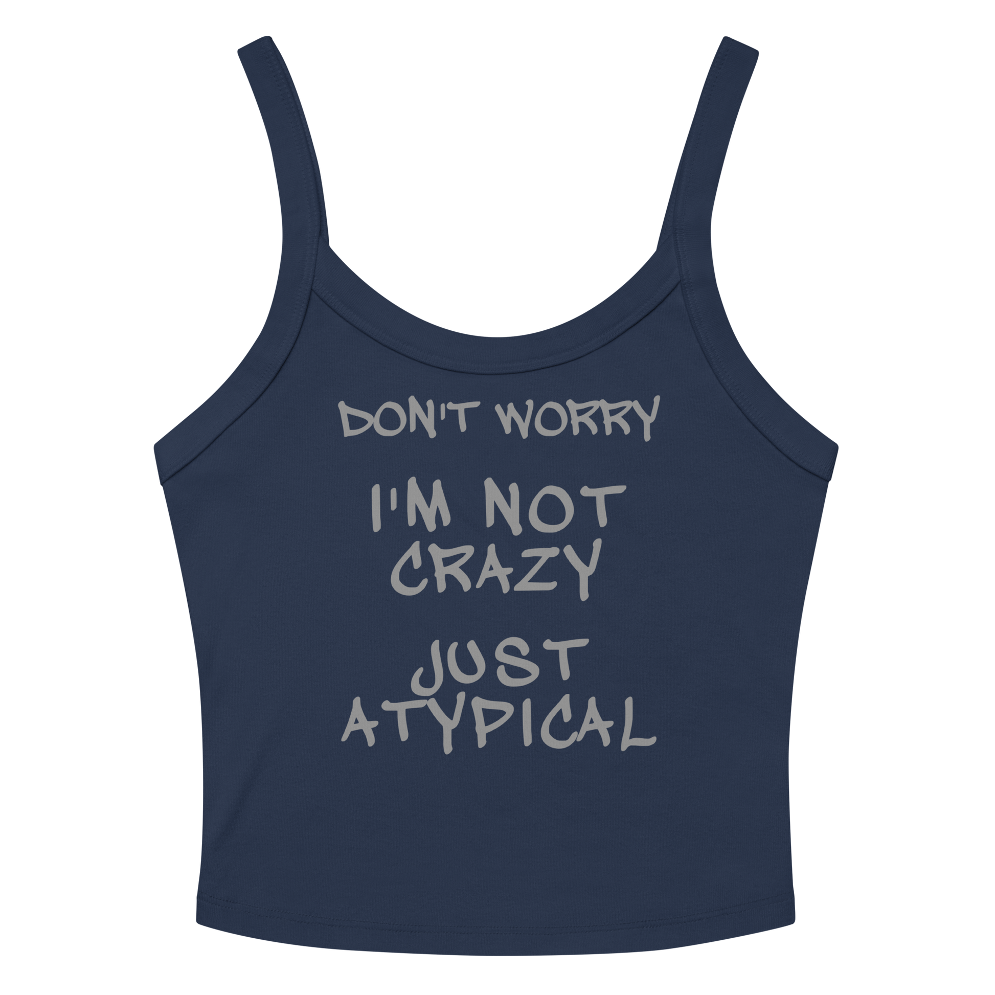 "Don't Worry I'm Not Crazy Just Atypical" printed on a solid navy blend women's micro-rib tanktop laying on a flat surface amongst sunglasses and shorts
