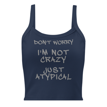 "Don't Worry I'm Not Crazy Just Atypical" printed on a solid navy blend women's micro-rib tanktop laying on a flat surface