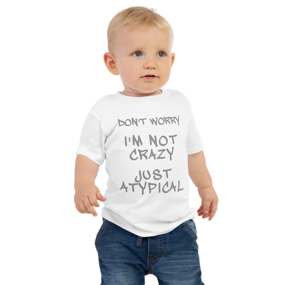 "Don't Worry I'm Not Crazy Just Atypical" printed on a white baby jersey short sleeve tee worn by a male