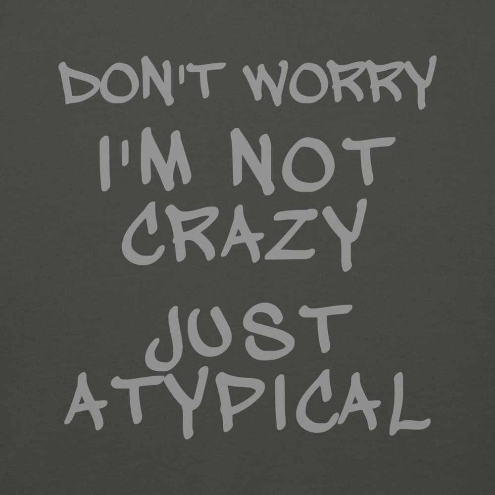 "Don't Worry I'm Not Crazy Just Atypical" printed on a vintage black background