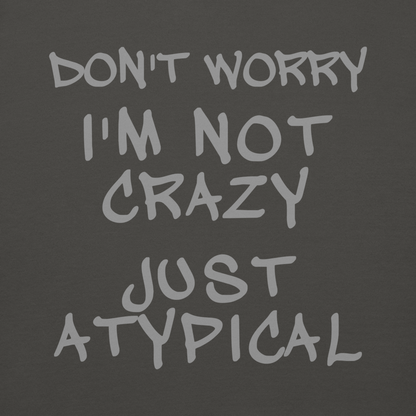 "Don't Worry I'm Not Crazy Just Atypical" printed on a vintage black background