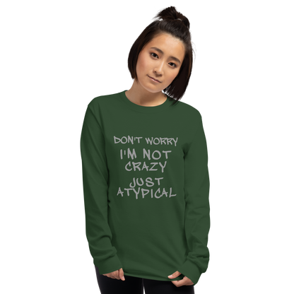 "Don't Worry I'm Not Crazy Just Atypical" printed on a forest green men's long sleeve shirt worn by a female