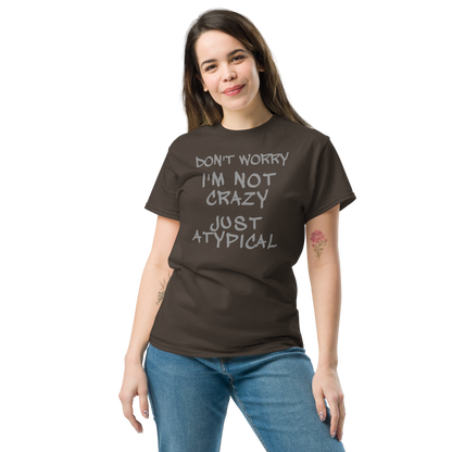 "Don't Worry I'm Not Crazy Just Atypical" printed on a dark chocolate unisex classic tee worn by a female