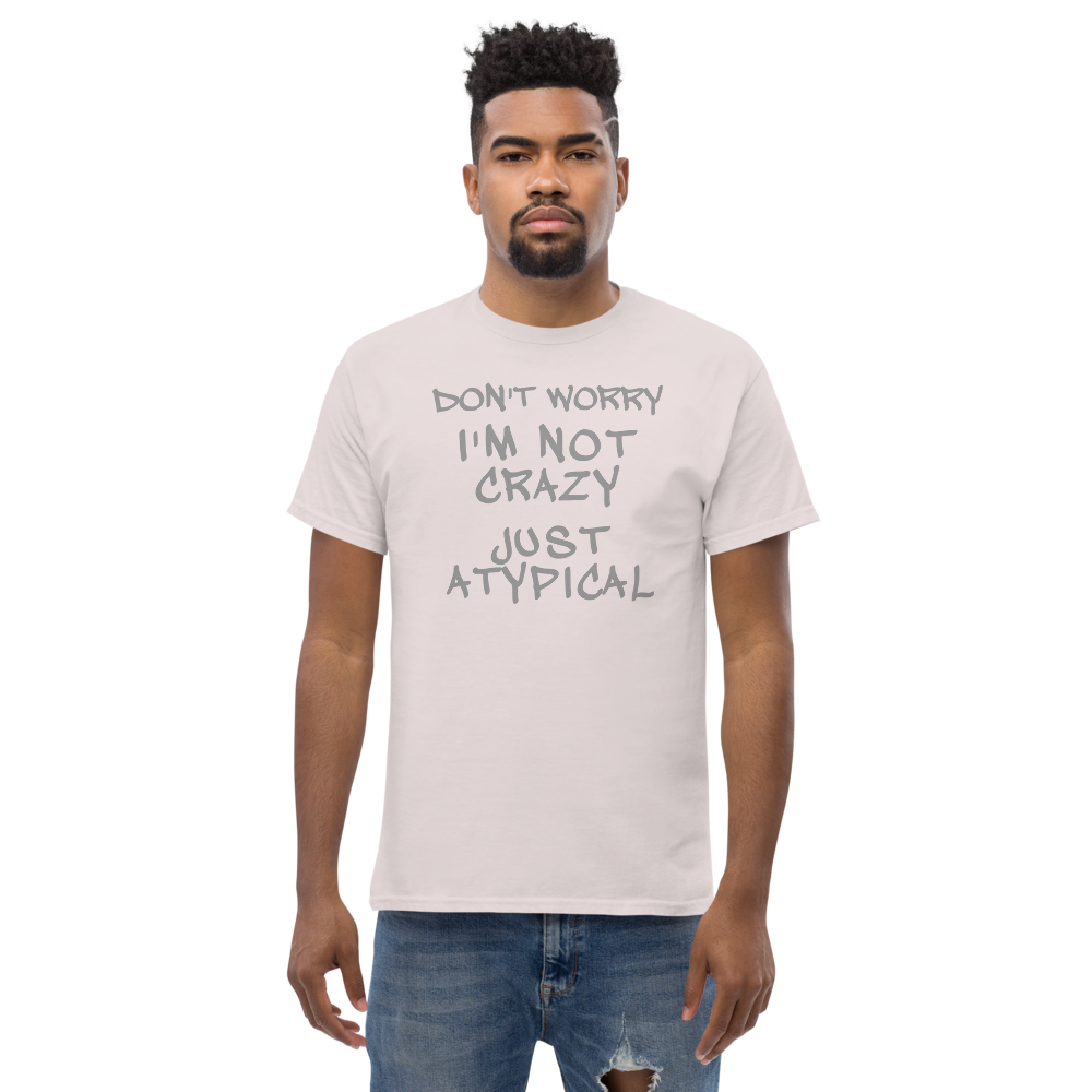 "Don't Worry I'm Not Crazy Just Atypical" printed on a ice grey unisex classic tee worn by a male