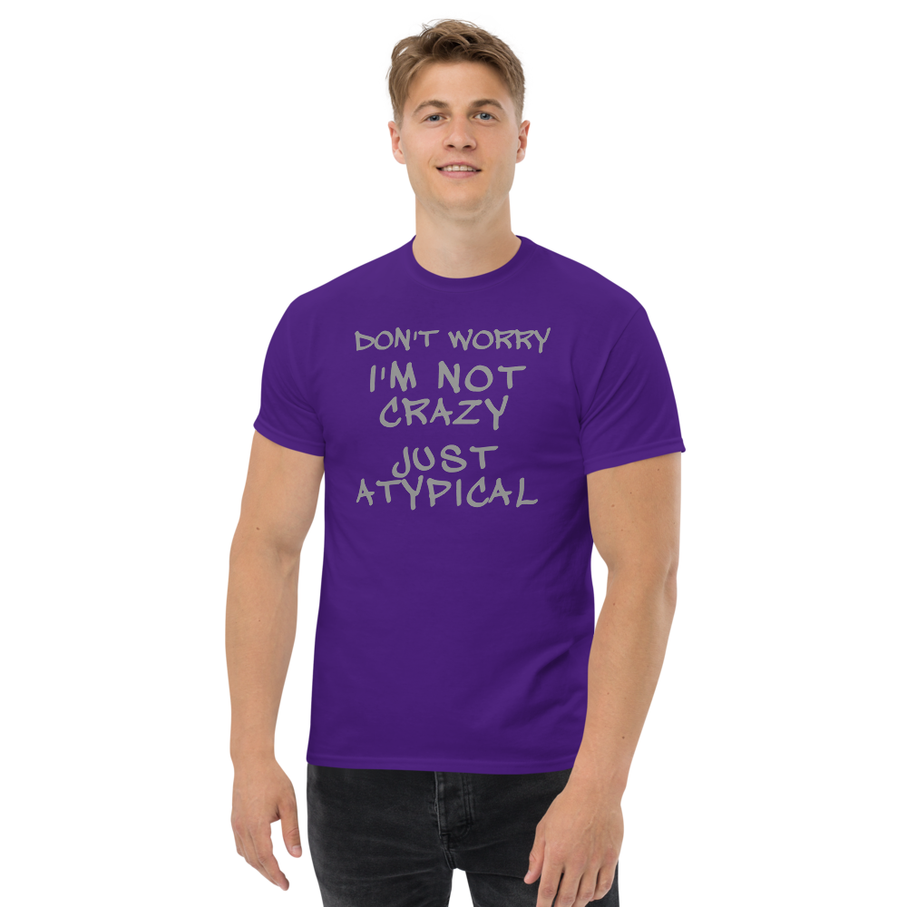 "Don't Worry I'm Not Crazy Just Atypical" printed on a purple unisex classic tee worn by a male