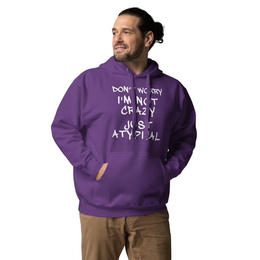 "Don't Worry I'm Not Crazy Just Atypical" printed on a purple unisex hoodie worn by a male