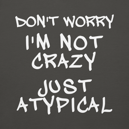 "Don't Worry I'm Not Crazy Just Atypical" printed on a vintage black background