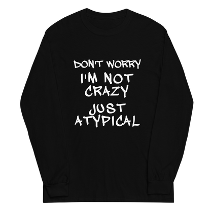 "Don't Worry I'm Not Crazy Just Atypical" printed on a black men's long sleeve shirt laying on a flat surface