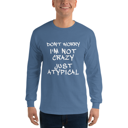 "Don't Worry I'm Not Crazy Just Atypical" printed on a indigo blue men's long sleeve shirt worn by a male