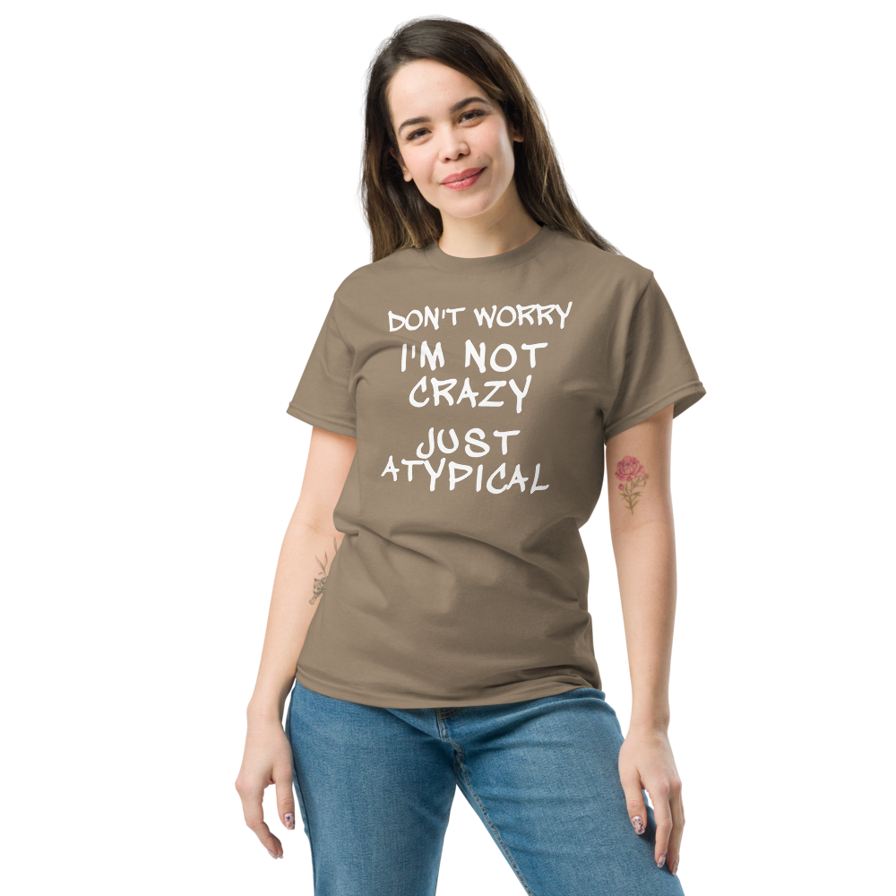 "Don't Worry I'm Not Crazy Just Atypical" printed on a brown savana unisex classic tee worn by a female