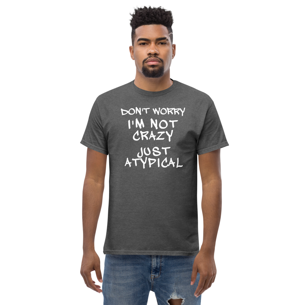 "Don't Worry I'm Not Crazy Just Atypical" printed on a dark heather unisex classic tee worn by a male