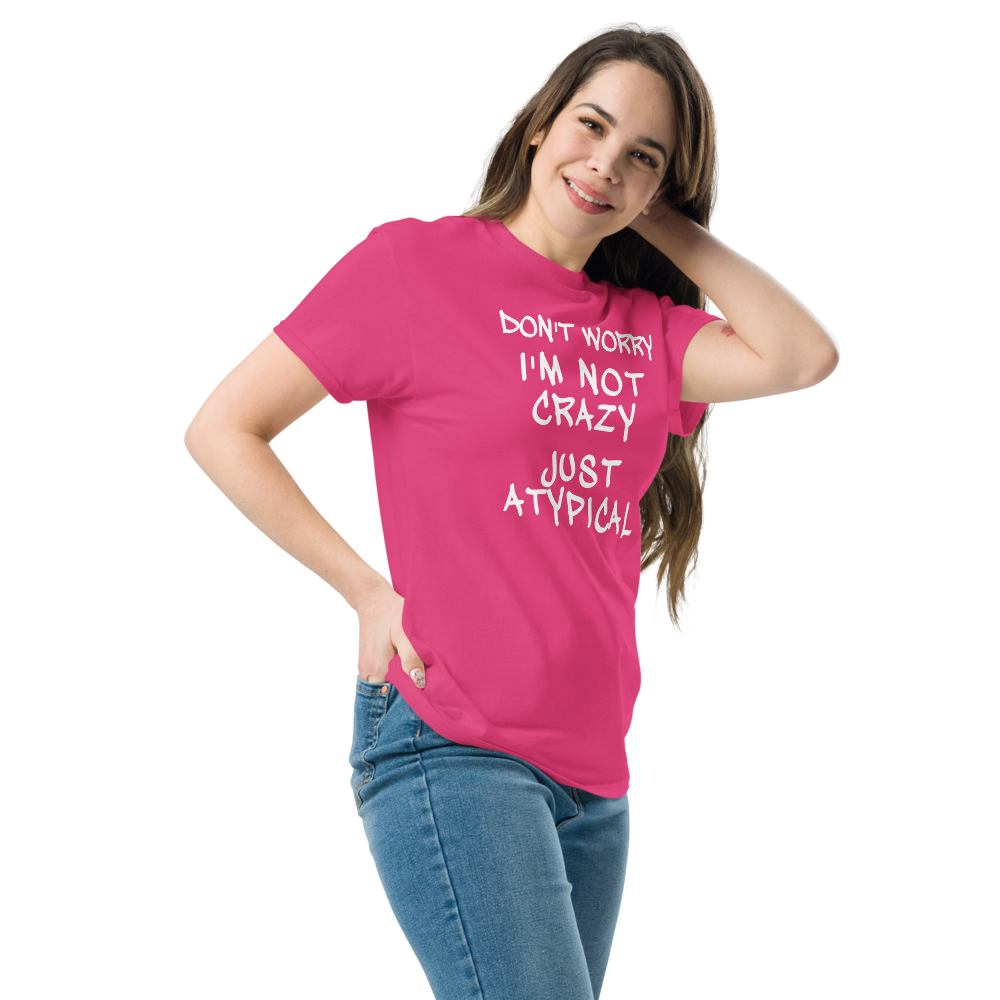 "Don't Worry I'm Not Crazy Just Atypical" printed on a heliconia unisex classic tee worn by a female