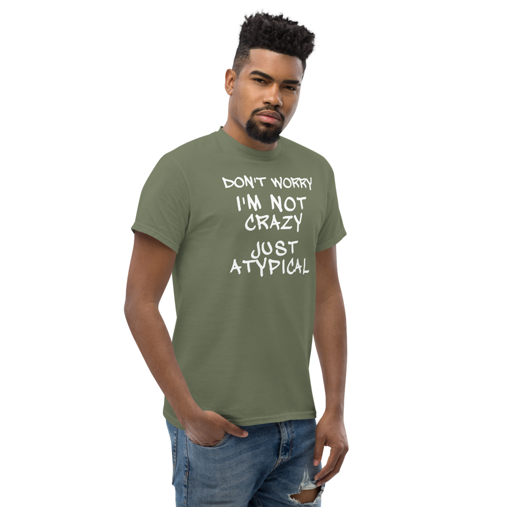 "Don't Worry I'm Not Crazy Just Atypical" printed on a military green unisex classic tee worn by a male