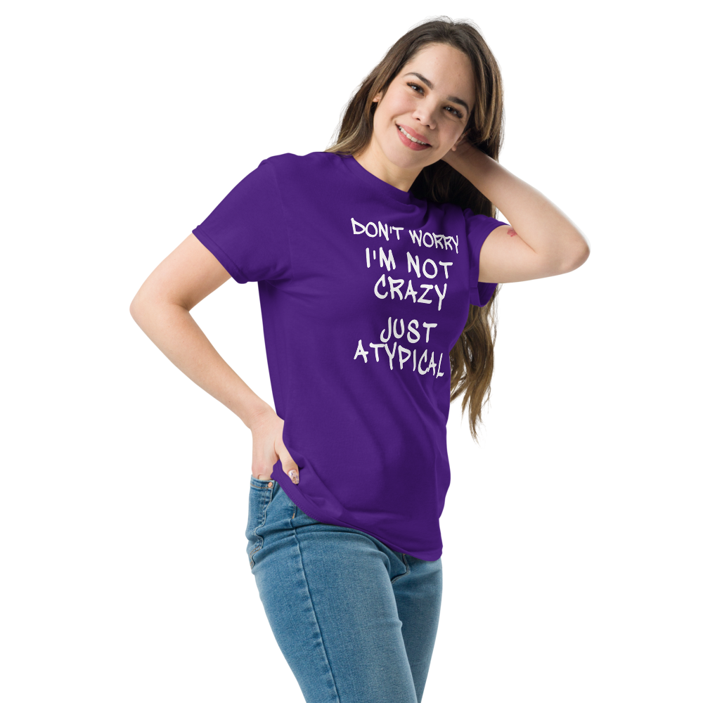 "Don't Worry I'm Not Crazy Just Atypical" printed on a purple unisex classic tee worn by a female