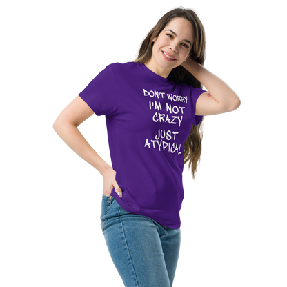 "Don't Worry I'm Not Crazy Just Atypical" printed on a purple unisex classic tee worn by a female