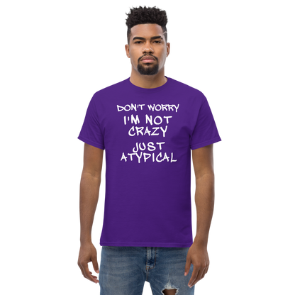 "Don't Worry I'm Not Crazy Just Atypical" printed on a purple unisex classic tee worn by a male