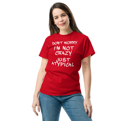 "Don't Worry I'm Not Crazy Just Atypical" printed on a red unisex classic tee worn by a female