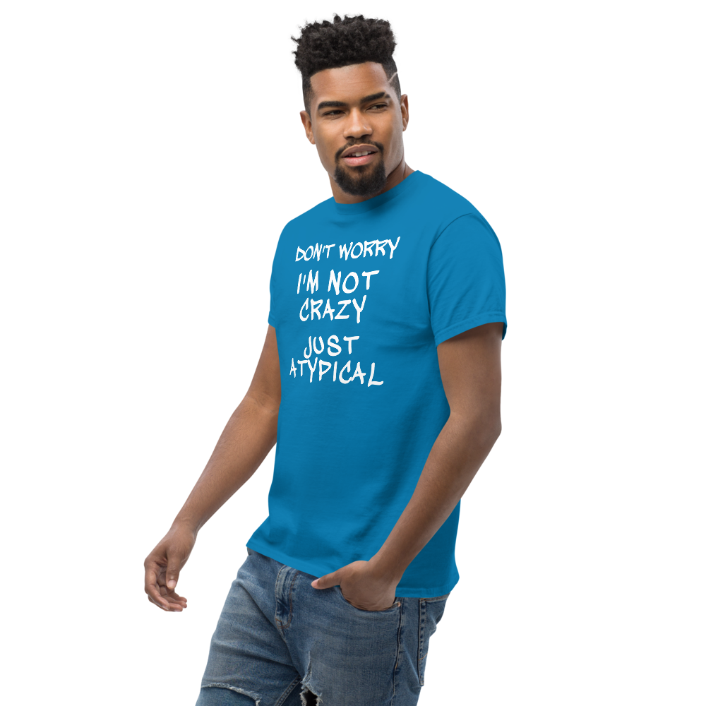 "Don't Worry I'm Not Crazy Just Atypical" printed on a sapphire unisex classic tee worn by a male