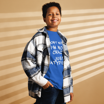 "Don't Worry I'm Not Crazy Just Atypical" printed on a royal youth classic tee worn by a male also wearing a jacket