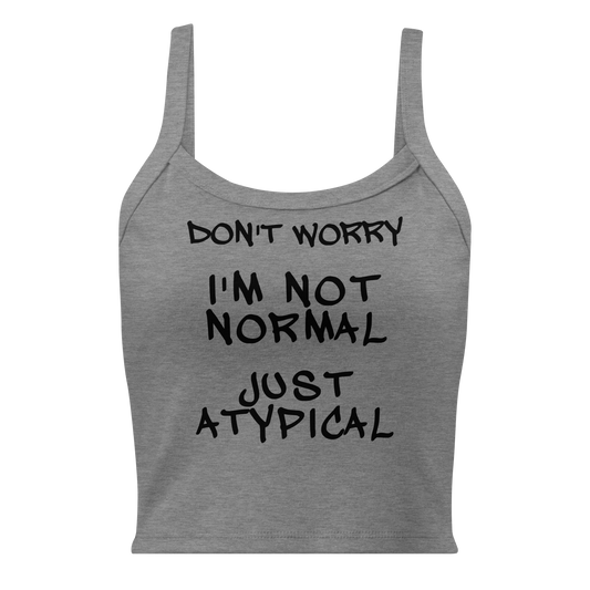 "Don't Worry I'm Not Normal Just Atypical" printed on a athletic heather women's micro-rib tanktop laying on a flat surface