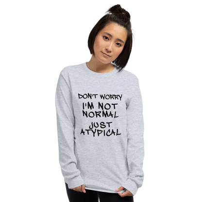 "Don't Worry I'm Not Normal Just Atypical" printed on a sport grey men's long sleeve shirt worn by a female