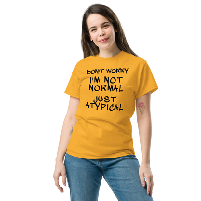 "Don't Worry I'm Not Normal Just Atypical" printed on a gold unisex classic tee worn by a female