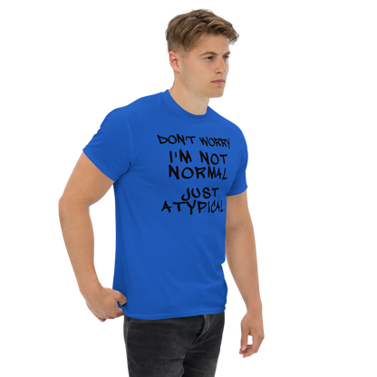 "Don't Worry I'm Not Normal Just Atypical" printed on a royal unisex classic tee worn by a male