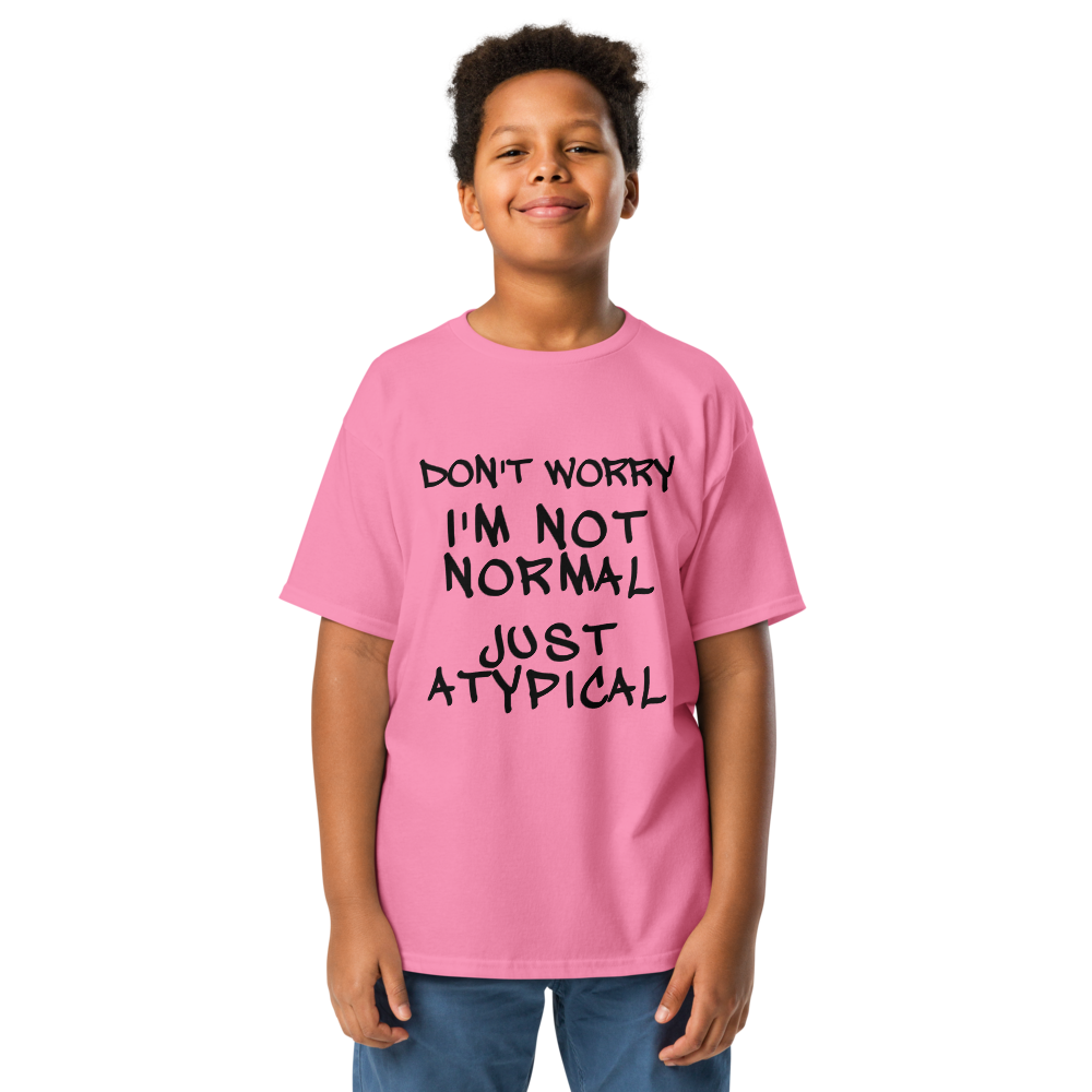 "Don't Worry I'm Not Normal Just Atypical" printed on a azalea youth classic tee worn by a male