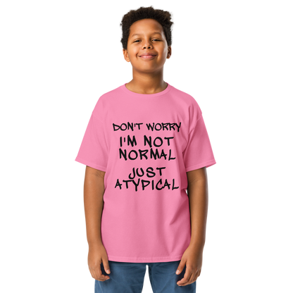 "Don't Worry I'm Not Normal Just Atypical" printed on a azalea youth classic tee worn by a male