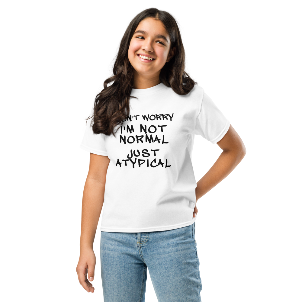 "Don't Worry I'm Not Normal Just Atypical" printed on a white youth classic tee worn by a female