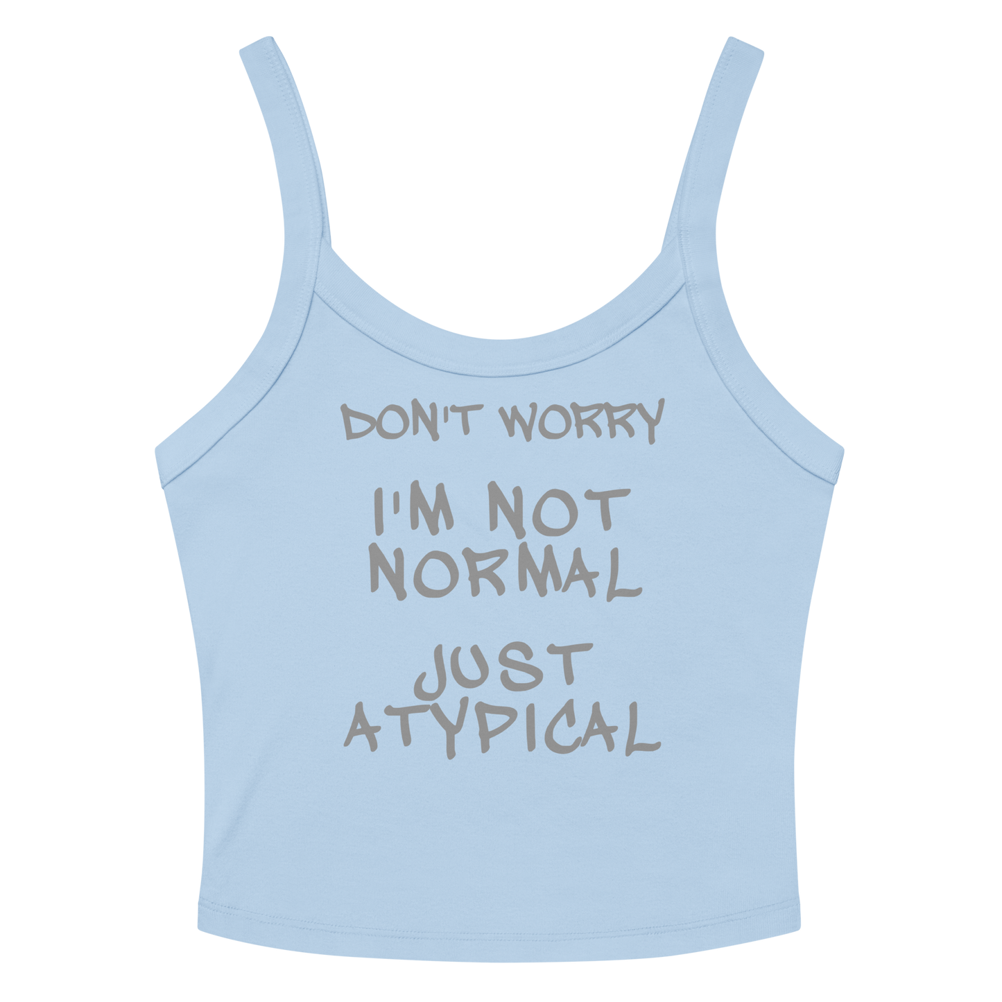 "Don't Worry I'm Not Normal Just Atypical" printed on a solid baby blue blend women's micro-rib tanktop laying on a flat surface amongst sunglasses and shorts