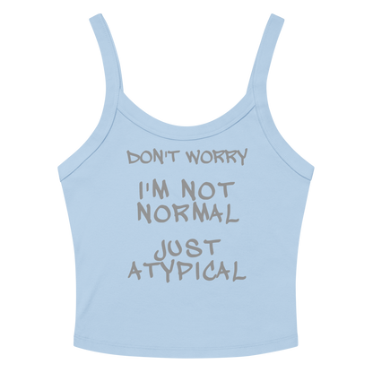 "Don't Worry I'm Not Normal Just Atypical" printed on a solid baby blue blend women's micro-rib tanktop laying on a flat surface amongst sunglasses and shorts