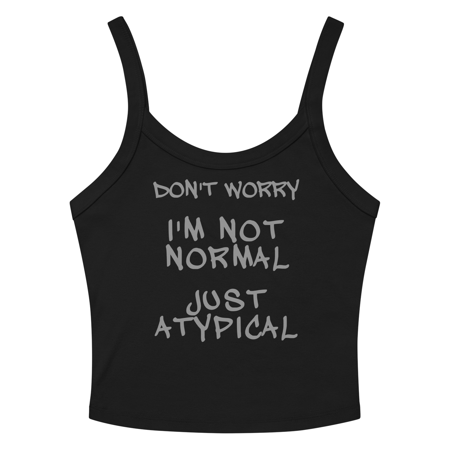 "Don't Worry I'm Not Normal Just Atypical" printed on a solid black blend women's micro-rib tanktop laying on a flat surface amongst sunglasses and shorts