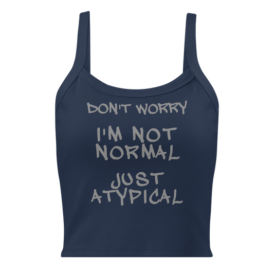 "Don't Worry I'm Not Normal Just Atypical" printed on a solid navy blend women's micro-rib tanktop laying on a flat surface