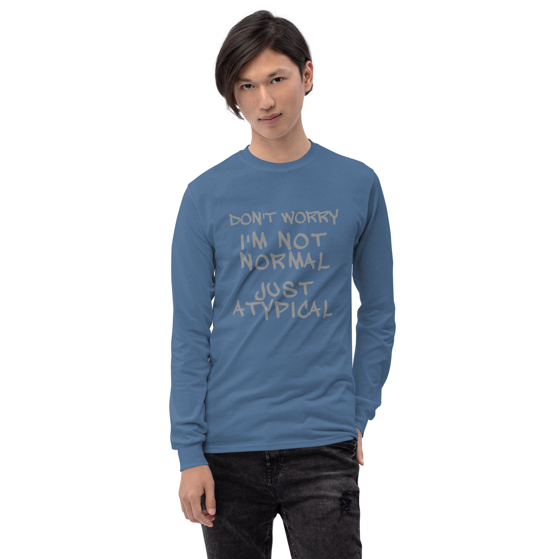 "Don't Worry I'm Not Normal Just Atypical" printed on a indigo blue men's long sleeve shirt worn by a male