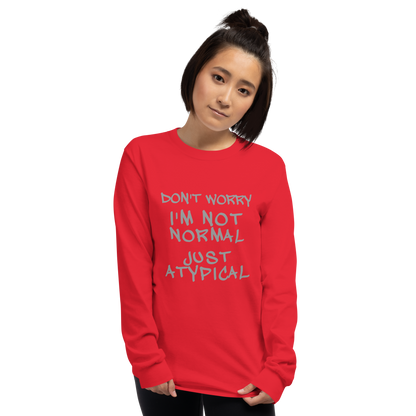 "Don't Worry I'm Not Normal Just Atypical" printed on a red men's long sleeve shirt worn by a female