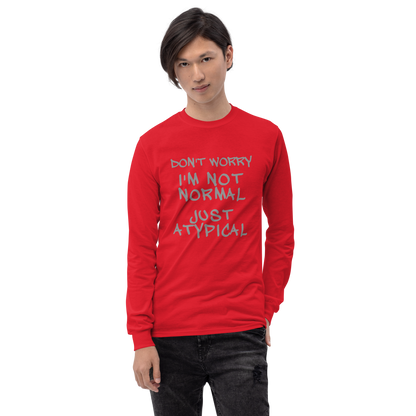 "Don't Worry I'm Not Normal Just Atypical" printed on a red men's long sleeve shirt worn by a male