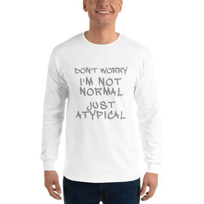 "Don't Worry I'm Not Normal Just Atypical" printed on a white men's long sleeve shirt worn by a male