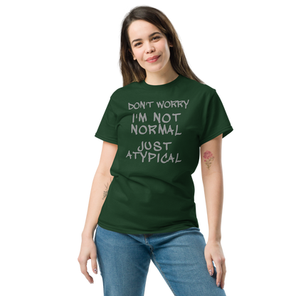 "Don't Worry I'm Not Normal Just Atypical" printed on a forest green unisex classic tee worn by a female