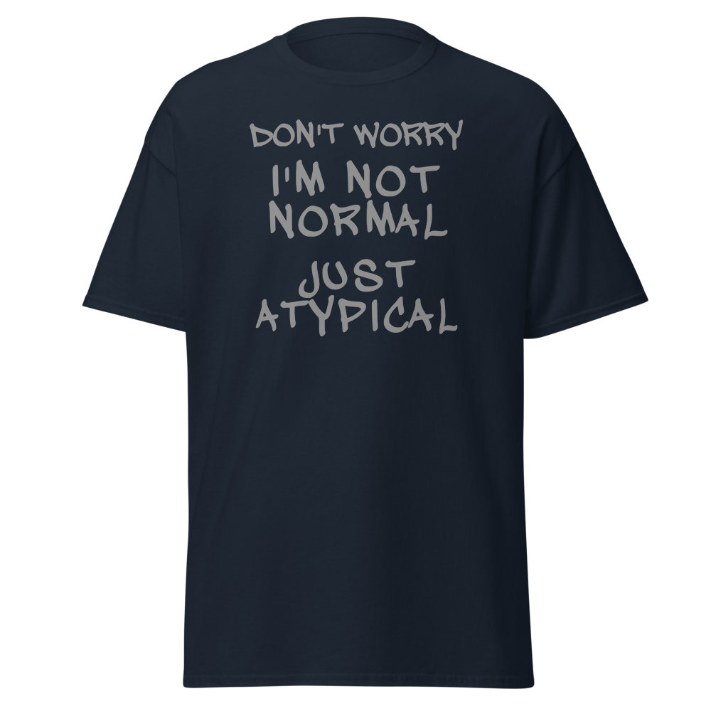 "Don't Worry I'm Not Normal Just Atypical" printed on a navy unisex classic tee laying on a flat surface