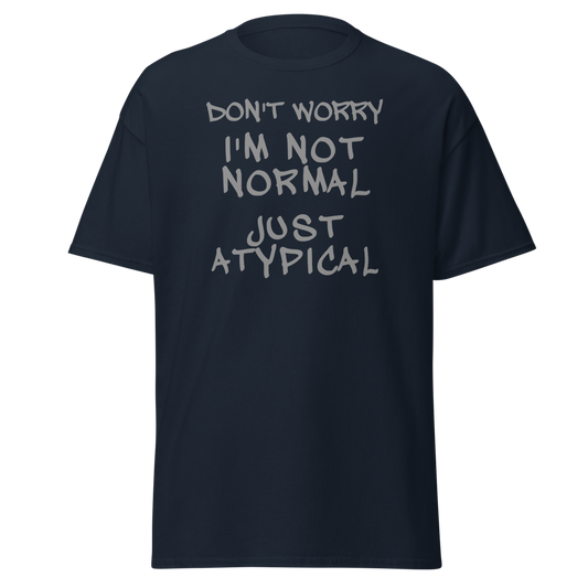 "Don't Worry I'm Not Normal Just Atypical" printed on a navy unisex classic tee laying on a flat surface