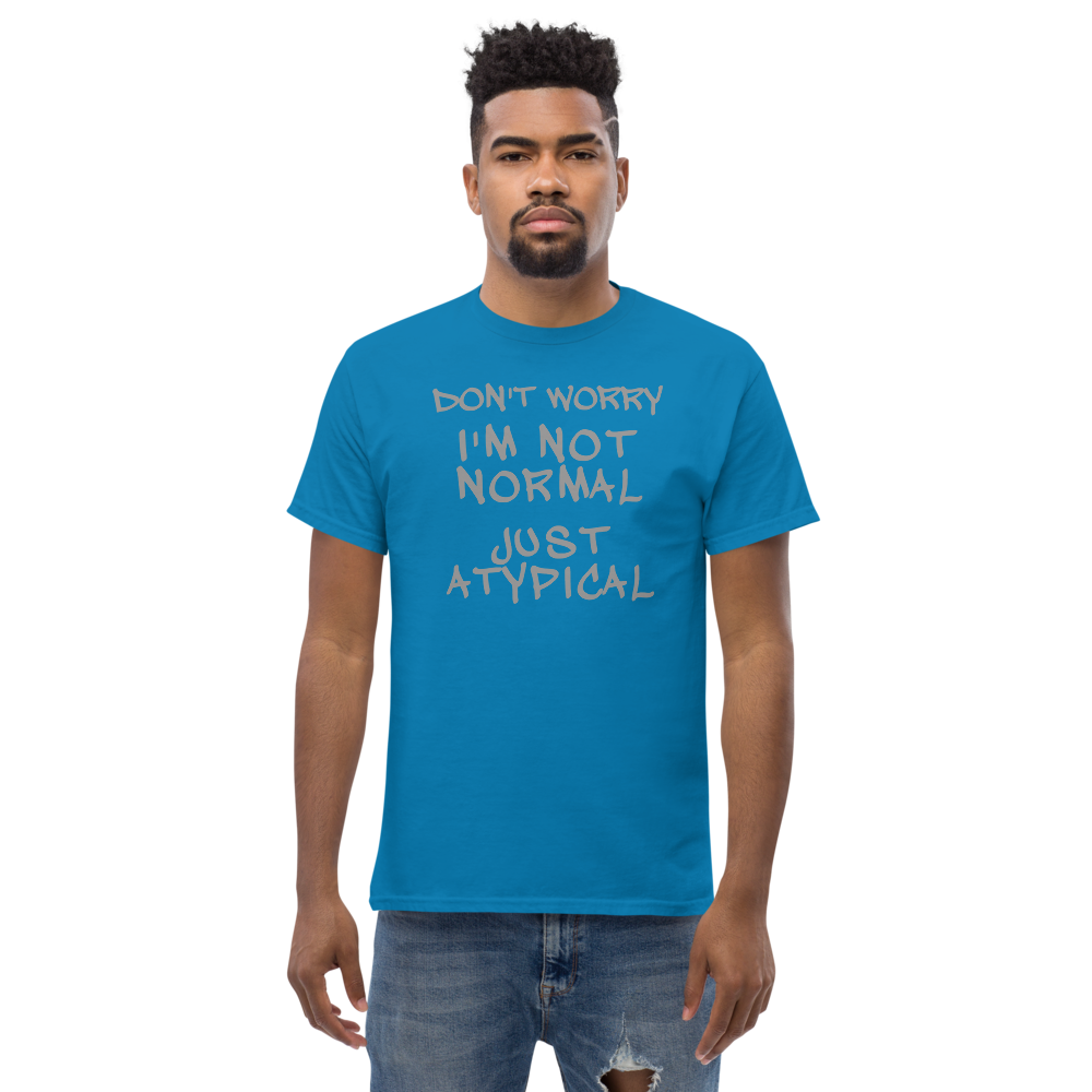 "Don't Worry I'm Not Normal Just Atypical" printed on a sapphire unisex classic tee worn by a male